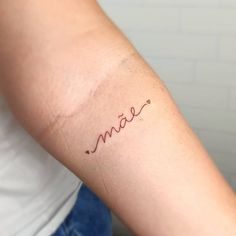 a woman's arm with the word love written on it