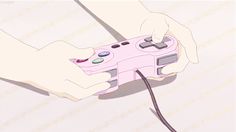 a person holding a game controller in their right hand and pressing buttons on the other