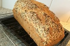 a loaf of bread sitting on top of a cooling rack