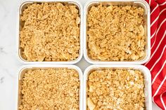 four trays filled with baked oatmeal sitting on top of a table