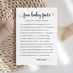 the fun baby fact game is shown on top of a woven piece of cloth next to it