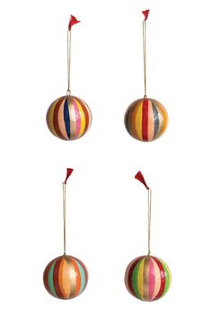 three colorful striped ornaments hanging from strings on a white background, each with a red flag