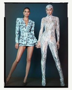 two women in bodysuits standing next to each other with their hands on their hips