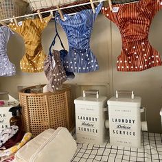 laundry products are hanging from the clothes line in a shop with other items on display