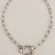 Carabiner Chain choker Carabiner Chain Necklace-Choker Necklace-Clasp Chain Necklace-Silver Cable Necklace-Silver Shackle Necklace-Shackle Jewelry-Padlock Charm A beautiful shiny silver chain made up of paperclip links. The chain is brass and has several plating coatings of color to give the silver electroplated finish. It is a high quality chain choker chain. The anchor shackle clasp gives the necklace a modern and unusual edge. It is Silver Plated - Rhodium Plated. Size 21 x 25 mm To finish of Silver Metal Necklace With Carabiner Clasp, Silver Necklace With Carabiner Clasp In Metal, Silver Link Chain Necklace With Carabiner Clasp, Silver Link Jewelry With Carabiner Clasp, Silver Toggle Clasp Chain Choker, Silver Toggle Choker Necklace With Lobster Clasp, Silver Choker Chain Necklace With Toggle Clasp, Silver Toggle Chain Choker Necklace, Necklace Clasp