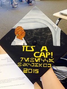 a graduation cap with an orange cat on it