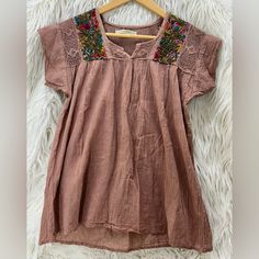 Custom Designed In Mexico, With Natural Dyes On 100% Linen Fabric. Hand Embroidered Designs. Dry Clean Or Hand Wash On Gentle Cycle With Like Colors. Pit To Pit: 18.5 Inches Length: 26 Inches Bottom Width: 23 3/4 Inches Bohemian Cotton Blouse With Tonal Embroidery, Embroidered Brown Tops For Festival, Brown Embroidered Festival Top, Bohemian Brown Tops With Floral Embroidery, Bohemian Brown Top With Floral Embroidery, Bohemian Embroidered Brown Tops, Summer Brown Blouse With Floral Embroidery, Artisan Shop, Embroidered Tops