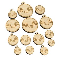 wooden charms with different designs on them