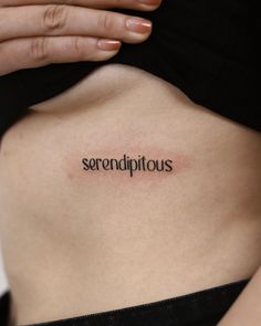 a woman's stomach with the word serendipitious written on it