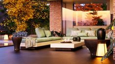 a living room filled with lots of furniture next to a fire place in front of a window