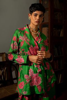 Green wrap around blazer featuring blooming wildflower garden and floral print, hand highlighting using tone to tone sequins, zari, cutdana and mirror embellishments. Comes with straight cut pant with side pockets.
Components: 2
Pattern: Printed
Type Of Work: Floral Pattern
Neckline: Shawl Collar
Sleeve Type: Straight Full
Fabric: Cotton Silk
Color: Green
Other Details: 
Embroidered highlights
Side pocketed pant
Attached lining
Note: Belt worn by the model is not for sale
Occasion: Party - Aza F Paulmi And Harsh, Straight Cut Pants, Green Wrap, Wildflower Garden, Blazer Set, Floral Blazer, Printed Blazer, Pant Set, Green Fabric