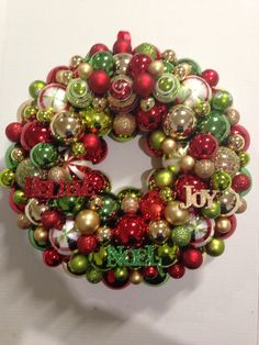 a christmas ornament wreath hanging on the wall