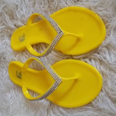 Kali Joy Rhinestone V-Strap Jelly Flat Flip Flops Bright Yellow Size 8 If You Want To Walk On The Beach And Explore The Shore, Joy Jelly Flip Flops Are Built Durably To Let Her Feet Do Just That. Featuring A Rhinestone V-Strap For Easy Slip On, And A Man Made, Animal Friendly, Jelly, Waterproof Material For Durability. These Flip Flops Are Sure To Be A Hit Whether At The Beach Or At The Pool This Summer! Never Worn! A Few Minor Transfer Marks On The Edges And Bottom Of Shoes From Previously Not