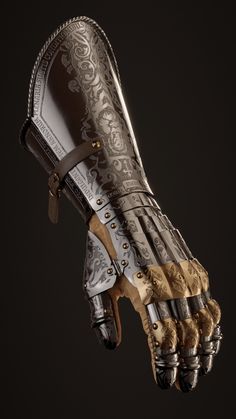 a hand that has some kind of armor on it