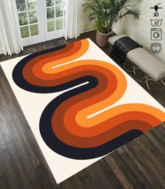 an orange and black area rug in a living room