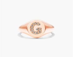 14K Rose Gold Diamond G Initial Signet Ring. This timeless ring will dazzle all who see it. Perfect for any age and occasion, this ring makes the perfect individualized gift! Rose Gold Oval Initial Fine Jewelry Ring, Rose Gold Oval Initial Ring Fine Jewelry, Oval Rose Gold Initial Ring Fine Jewelry, Fine Jewelry Rose Gold Oval Initial Ring, Rose Gold Diamond Signet Ring In Fine Jewelry Style, Rose Gold Polished Finish Signet Ring, Luxury Rose Gold Signet Ring With Brilliant Cut, Rose Gold Polished Finish Round Cut Signet Ring, Rose Gold Signet Promise Ring