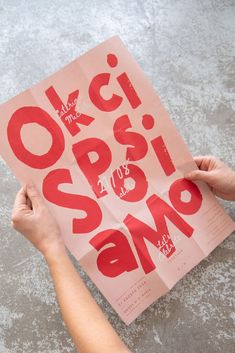 a person holding up a piece of paper with the words ocrisso on it