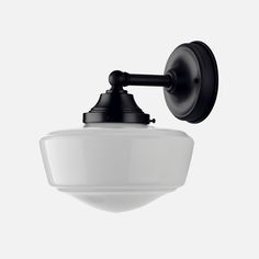 a black and white light fixture on a wall