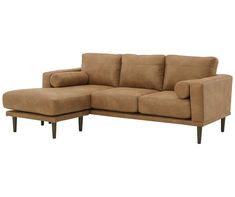 a brown couch sitting on top of a wooden frame