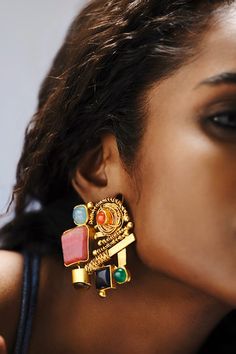 Gold toned earrings with abstract motifs, twisted cords and embellished with multi colored agate stones. - Aza Fashions Multicolor Gemstone Accent Fusion Earrings, Bohemian Multicolor Jeweled Earrings, Multicolor Bohemian Kundan Earrings, Bohemian Multicolor Natural Stones Earrings, Multicolor Hand-strung Bohemian Earrings, Bohemian Multicolor Multi-stone Earrings, Abstract Motifs, Bohemian Jewels, Multicolor Earrings