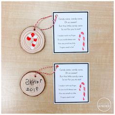 two wooden tags with candy canes on them