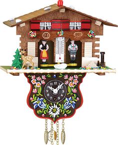 the cuckoo clock is decorated with flowers and other things on it's side,