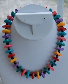 "Pretty and colorful is this multi-colored square plastic beaded necklace. The necklace has black spacers beads and measures 17\" in length. It is in very good vintage condition with minor wear. I see one small chip on a red bead. This is a fun, cheery necklace will be a nice addition to your summer jewelry collection!" Adjustable Multicolor Rectangular Beaded Necklaces, Multicolor Beaded Rectangular Necklace, Retro Multicolor Adjustable Necklaces, Retro Multicolor Beaded Necklace, Red Bead, Necklace Vintage, Plastic Beads, Summer Jewelry, Spacer Beads