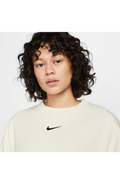 An embroidered Swoosh adds minimal branding to this cozy fleece sweatshirt cut for a relaxed, oversized fit that's enhanced by the dropped shoulders. 22" length (size Medium) Crewneck 80% cotton, 20% polyester Machine wash, tumble dry Imported Nike Sportswear Phoenix Fleece, Studded Accessories, Luxury Loungewear, Oversized Crewneck, Loungewear Luxury, Women's World Cup, Cut Sweatshirts, Nike Tech Fleece, Lace Headbands