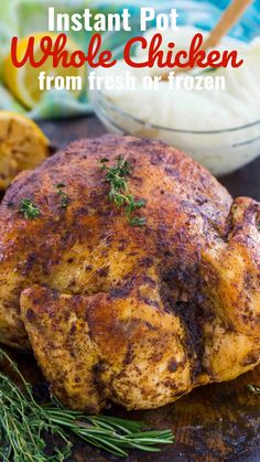 a whole chicken on a cutting board with lemons and other ingredients in the background