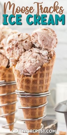 three scoops of ice cream sitting on top of a wire rack with the words moose tracks ice cream