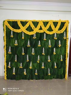 a green wall with yellow and white decorations