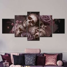 a living room with purple couches and skulls on the wall