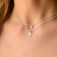 This layered silver cross necklace is a set of 2. The chains are solid sterling silver 925. They have an extension so that the size can be adjusted. The one necklace has a tiny cz charm on a chain while the other has a small cross on it. Cross Necklace Set, Silver Cross Necklace With Delicate Chain, Layered Necklaces Silver Cross, Hypoallergenic Silver Cross Necklace, Silver Pendant Cross Necklace, Fine Jewelry, Nickel-free Silver Cross Necklace, Layered Cross Necklace, Cross Necklace Women, Star Anklet