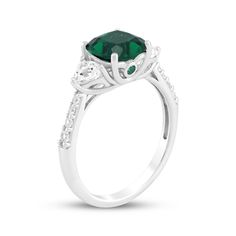 This glimmering lab-created emerald ring makes an unforgettable gift for your special occasion. Sterling silver A cushion-cut lab-created emerald is flanked by trillion-cut white lab-created sapphires Bezel-set round lab-created emeralds shimmer on the sides of the setting Round-cut white lab-created sapphires line the tapered shank Green Cushion Cut Diamond Ring For Formal Occasions, Green Cushion Cut Emerald Ring With Accent Stones, Cushion Cut Emerald Green Rings, Cushion Cut Emerald Green Jewelry, Green Cushion Cut Diamond Ring With Center Stone, Green Cushion Cut Ring For Gift, Green Cushion Cut Ring As Gift, Green Cushion Cut Jewelry For Wedding, Gift Emerald Ring With Brilliant Cushion Cut