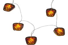 some lights that are hanging from strings on a string with the hogwarts symbol