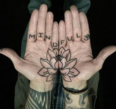 two hands with tattoos on their palms and the words mindfuls written in black ink