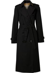 Black cotton blend double-breasted gabardine trench coat from Burberry featuring epaulettes, storm flap, belted waist, notched collar, double-breasted button fastening, long sleeves, belted cuffs, central rear vent, straight hem, mid-length, two side button-fastening pockets and Vintage Check-pattern lining. POSITIVELY CONSCIOUS: By buying this cotton product from Burberry, you’re supporting more responsibly grown cotton through the Better Cotton Initiative.. | Burberry Double-Breasted Gabardine Legacies Outfits, Bougie Style, Fedora Fashion, Burberry Clothing, Twilight Outfits, How To Have Style, Burberry Outfit, Burberry Coat, Burberry Trench