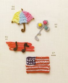 three crocheted items are displayed on a white surface, including an umbrella and other accessories