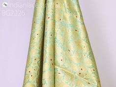 Mint Green Brocade Fabric By Yard Banarasi Indian Bridal Wedding Dress Varanasi Silk Crafting Sewing Costume Lehenga Drapery Blouses Upholstery. This is a beautiful multi color banarasi pure silk brocade in floral design fabric in multi color (Mint Green with Red) and Gold. ➤Product : Brocade Fabric ➤Fabric Type: Blended Silk (Viscose + Rayon and 30% Silk) Fine Quality Zari Brocade Weaving from Banaras ➤Color: Base color is Mint Green with Red and Gold. ➤Width: 35 Inches ➤Condition: New ➤Code: b Green Brocade Fabric, Indian Wedding Dresses, Sequin Saree, Viscose Rayon, Silk Brocade, Design Fabric, Indian Wedding Dress, Brocade Fabric, Varanasi