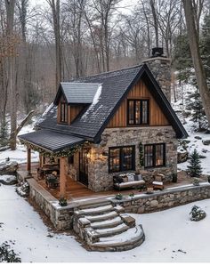 a stone and wood cabin in the woods