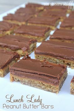 chocolate peanut butter bars on a white plate with the words lunch lady peanut butter bars