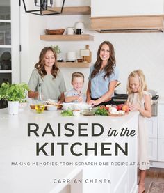 the cover of raised in the kitchen, featuring three women and two children preparing food