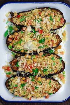 stuffed eggplant with rice and vegetables on a plate