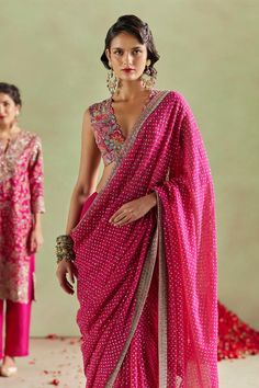 Hot pink georgette saree with all over multi color bandhani resham, sequin work and contrast zardozi hand embroidered border.  Components: 1 Pattern: Hand Embroidered Type Of Work: Sequin, Resham and Zardozi Work Fabric: Georgette  Color: Pink Other Details:  Contrast border Note: The stitched blouse worn by the model and the outfit worn by the other model at the back are not being sold Occasion: Sangeet,Wedding - Aza Fashions Hot Pink Saree Contrast Blouse, Pink Saree Contrast Blouse, Pink Saree Blouse, Mrunalini Rao, Saree Blouses Online, Saree Georgette, Zardozi Work, New Saree Blouse Designs, Georgette Blouse