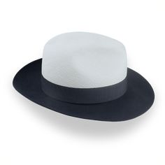 An Elegant Two-Tone Panama Fedora Hat for Any Occasion Elevate your style with The Monarch, an elegant two-tone Panama fedora hat that seamlessly blends dark grey and off-white for a striking look. Featuring a durable Toquilla straw crown and a luxurious rabbit fur felt brim, this hat offers a unique design perfect for any occasion. The center-dent crown adds sophistication, while the 3" raw-edge snap brim provides versatility. Complete with a grosgrain ribbon hatband and a genuine leather sweat Homburg Hat, Hats For Big Heads, Strong Font, The Mirage, Homburg, 3 R, The Monarch, Hat Box, Formal Casual