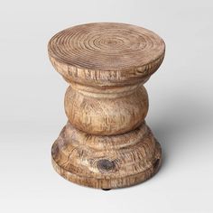 a wooden stool made out of logs on a white background