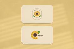 two business cards with sunflowers on them