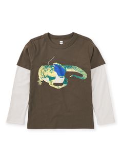 A colorful lizard sure to make any kiddos day! Made from 100% soft cotton jersey, this long sleeve tee keeps its shape and color wash after wash. Layered long sleeves ups the style game. Above thigh length. Cotton Tops With Dinosaur Print For Fall, Cotton Top With Dinosaur Print For Fall, Cotton Long Sleeve Tops With Dinosaur Print, Long Sleeve Cotton Tops With Dinosaur Print, Long Sleeve Cotton Top With Dinosaur Print, Long Sleeve Top With Dinosaur Print For Fall, Colorful Lizards, Layered Sleeves, Pocket Tee Shirts