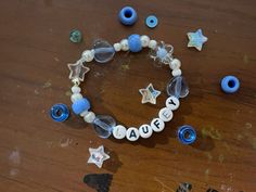 a bracelet with beads and letters on it