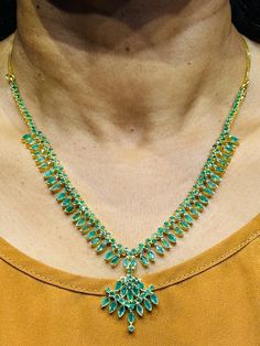 22 Karat Gold Emeralds Necklace & Drop Earrings Set
  
    Note: We can make this same design with Rubies, Blue Sapphire 
  or in any other colored stone of your choice for the same price. - 235-SET284 - in 34.050 Grams for USD $3,534.78 USD. 
Made in India by Totaram Jewelers Online this product is in Gold - 22 Karat BIS Hallmark 916 Gold  & is an excellent gift for Adult - Women. Ships fully insured with secured guaranteed delivery for free with your order over $250 from New Jersey Hand-set Emerald Necklace For Celebration, Celebration Hand-set Emerald Necklace, Traditional Yellow Gold Emerald Necklace For Formal Occasions, Traditional Yellow Gold Emerald Necklace For Formal Events, Festive Yellow Gold Emerald Necklace With Gemstone, Gold Emerald Necklace Hand Set Fine Jewelry, Elegant Green Emerald Necklace In 22k Gold, Gold Emerald Jewelry Sets For Formal Occasions, Gold Emerald Jewelry Sets For Formal Events